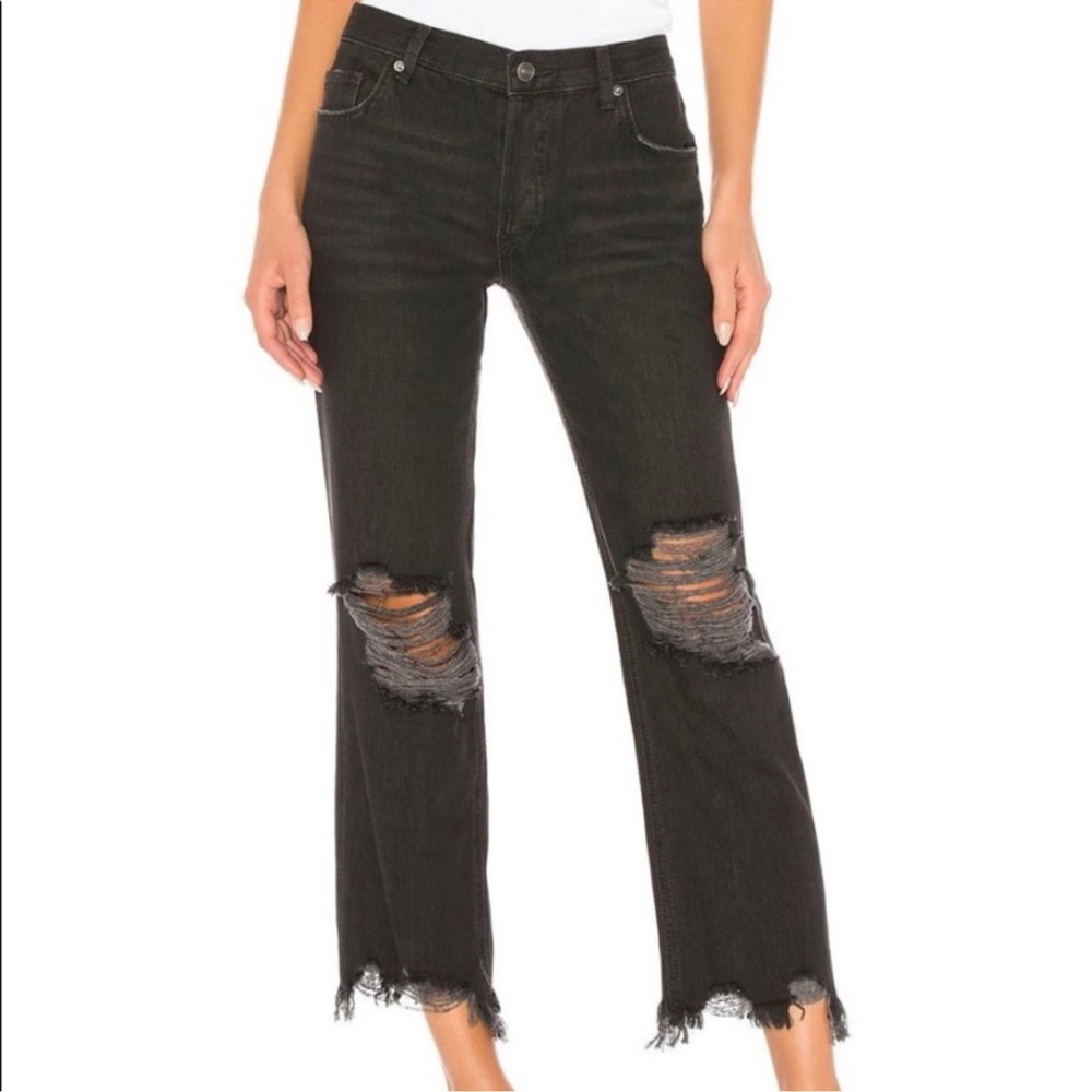 FREE PEOPLE distressed black jeans.